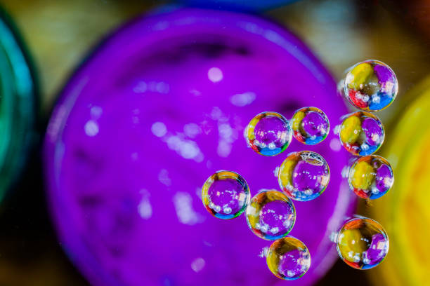 bubble on grass above plastisol ink in the bucket.Photography in the Thaisign screen shirt factory
