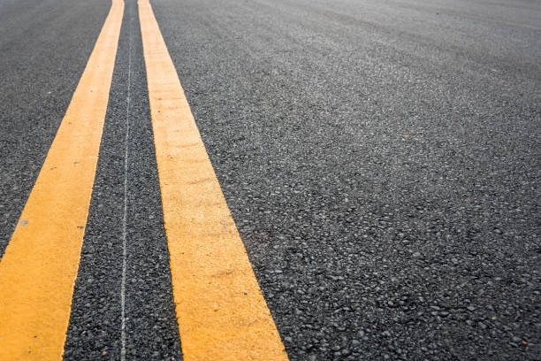 istock Asphalt road with yellow double line 808338086