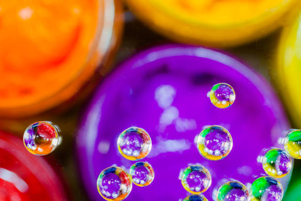 istock colorful bubble above violet plastisol ink in can. 808338202