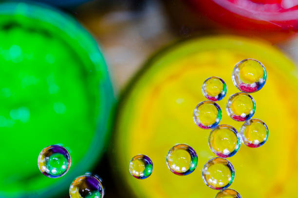 istock colorful bubble above yellow plastisol ink in can. 808340400
