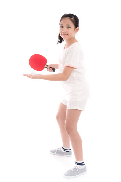 Beautiful Asian girl  playing table tennis on white background isolated