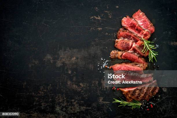 Sliced Medium Rare Grilled Beef Ribeye Steak Stock Photo - Download Image Now - Meat, Steak, Beef