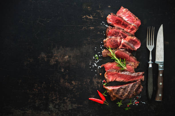istock Sliced medium rare grilled beef ribeye steak 808351096
