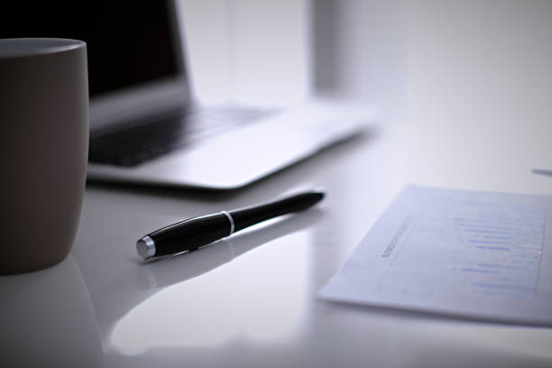 istock Office workplace with a laptop and financial documents 808368738