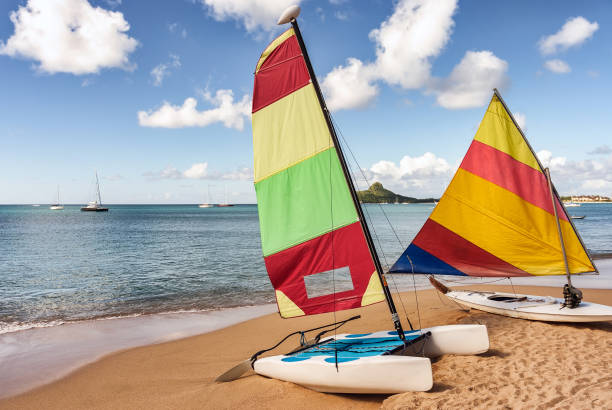 istock Colorful sailboat and kayak on sandy beach 808385054