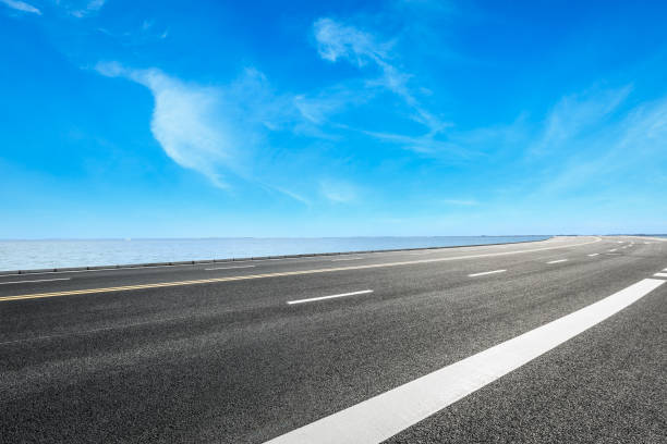 istock Asphalt road and sky cloud landscape 808386592