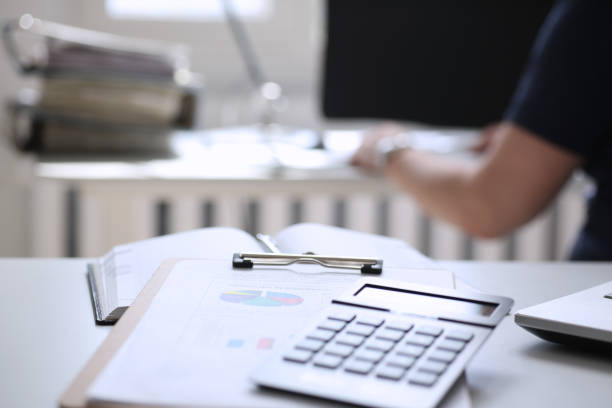istock Black calculator and financial statistics on clipboard pad 808398206