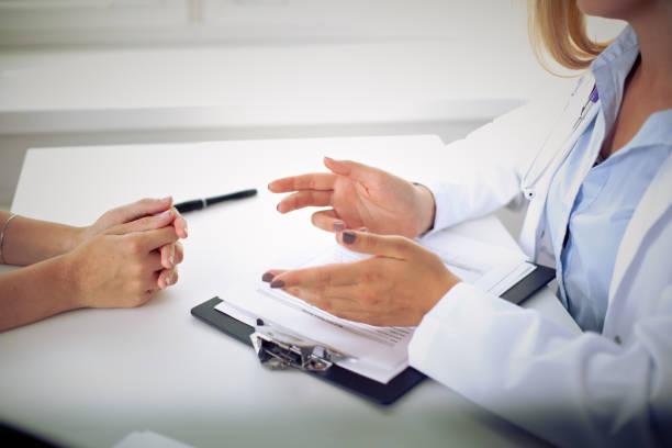 istock Doctor and patient are discussing something, just hands at the table 808411004