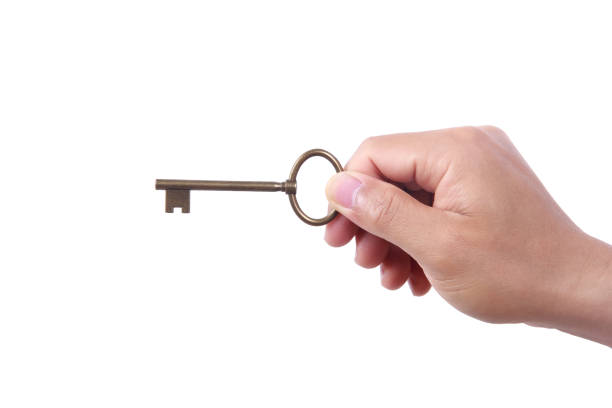 istock Male hand holding a golden key 808417370