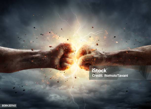 Conflict Concept Two Fists In Impact Stock Photo - Download Image Now - Strength, Rivalry, Fist