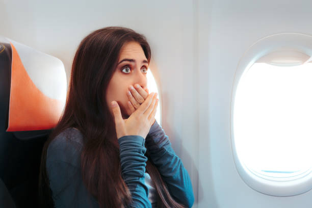 istock Woman Sitting By the Window on An Airplane Feeling Sick 808435152