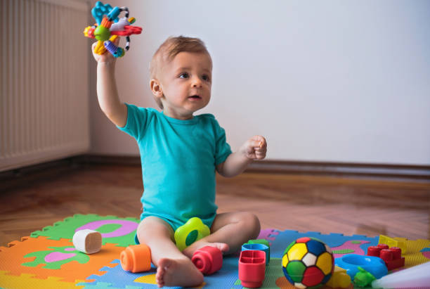 istock Baby playing with toys 808437364