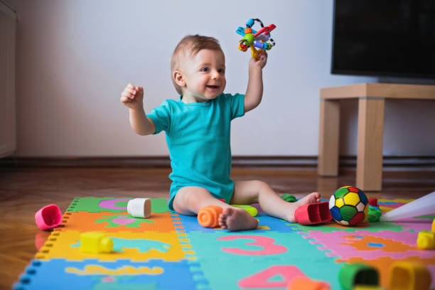istock Little boy playing with toys 808445494