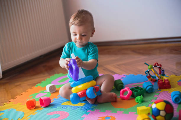 istock Little boy playing on the floor 808450142