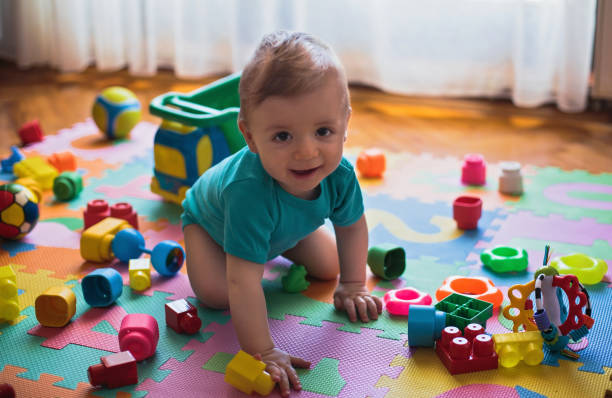 istock Baby boy playing on the floor 808451960