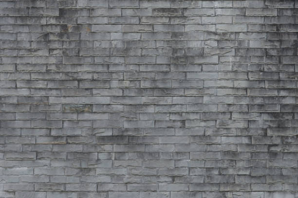 istock Old brick wall background. Grunge texture. Black wallpaper. Dark surfaceAbstract weathered texture stained old stucco light gray and aged paint white brick wall background in rural room, grungy rusty blocks of stonework technology color horizontal archite 808452554