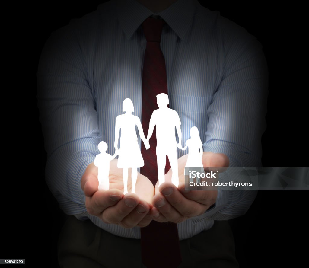 Family insurance Family insurance and security concept with a dark background Arm In Arm Stock Photo