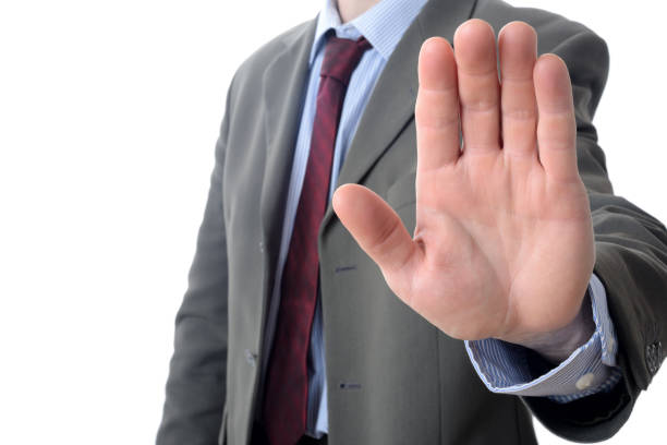 istock Businessman show STOP against white background 808481508