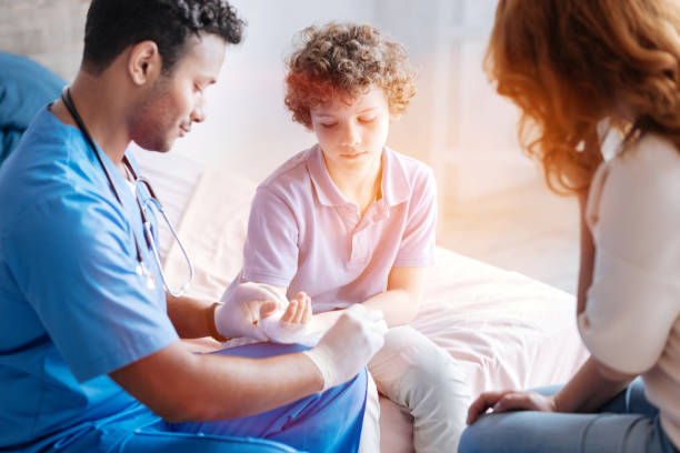 istock Upset kid looking at his injured hand 808483852