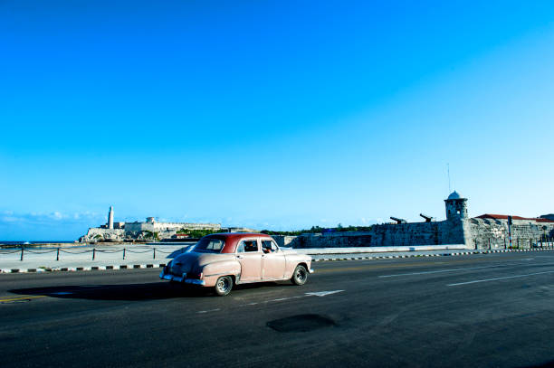 istock Morro Castle (fortress) and old car in Havana, Cuba 808506404