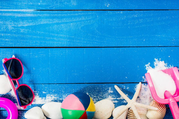 istock summer season, beach on wooden, flat lay with copy space 808512478