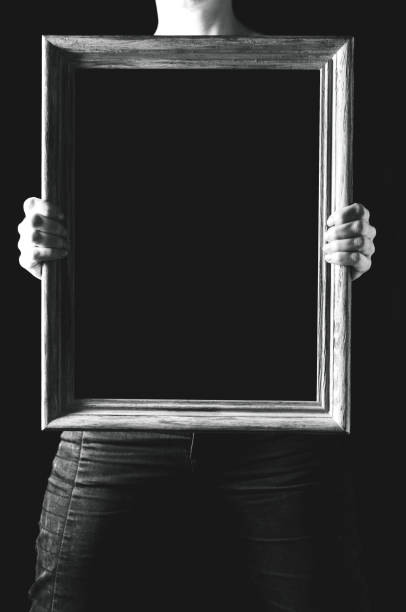 istock Black canvas in the woman's hands. The place for the text or design on a canvas 808513232