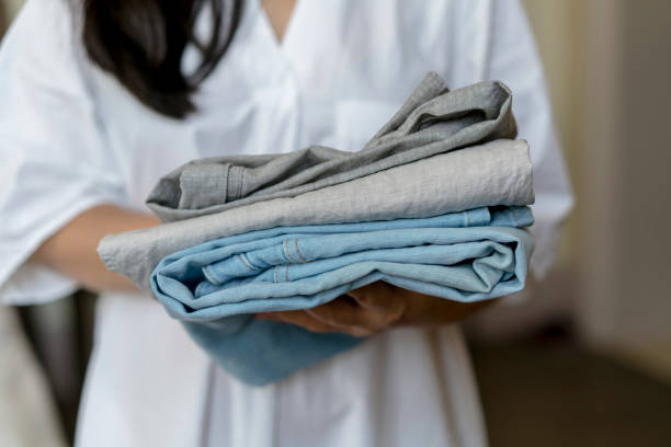 istock woman arranging clean clothes 808529902
