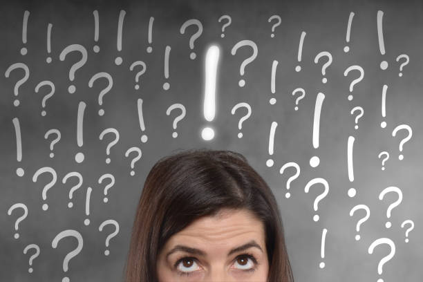istock young woman with exclamation and question marks on her head 808530230