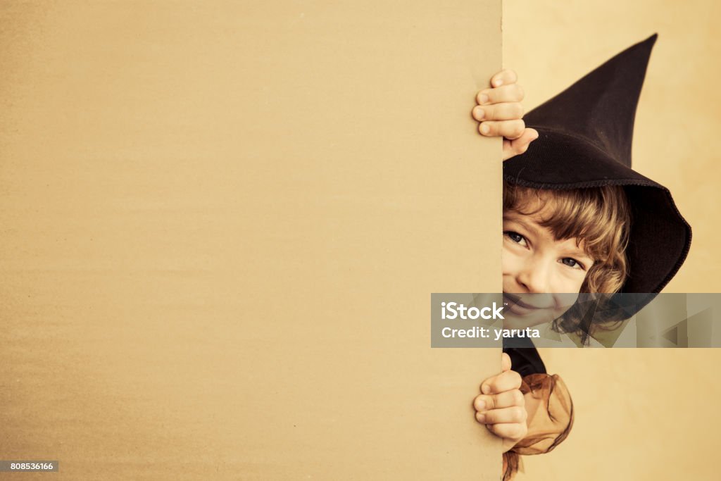 Halloween child Funny child dressed witch costume. Halloween holidays concept Autumn Stock Photo