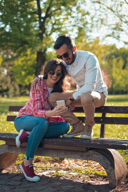 istock Beautiful couple having fun in the park 808560772