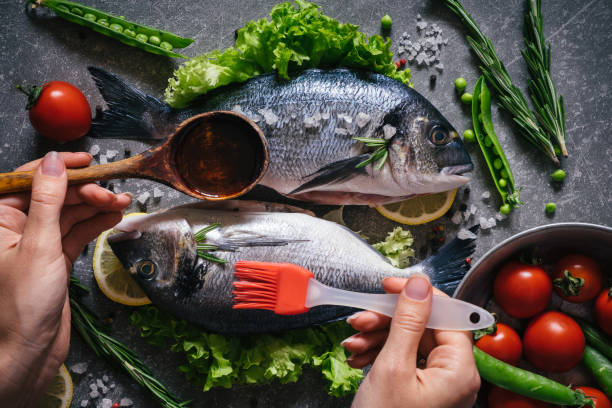 istock Healthy seafood with vegetables, herbs and spices. 808565302