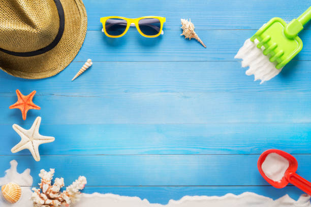 istock Beach toys on blue plank, holiday summer 808579992