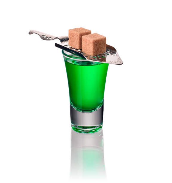 Absinthe shots with sugar and spoon isolated Absinthe shots with sugar and spoon isolated on white background. (With clipping path) absinthe spoon stock pictures, royalty-free photos & images