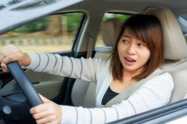 istock Terrified woman driving and having car accident or crash something. 808590992