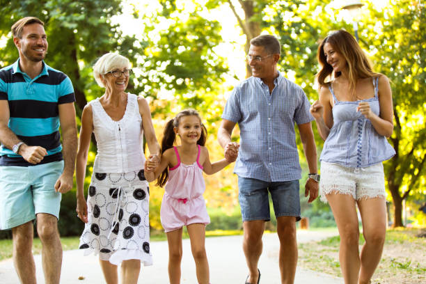 istock Happy multi-generation family walking outdoors and communicating 808592132