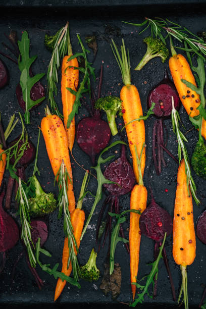 istock Top view of vegetables for roasting on dark background 808592154