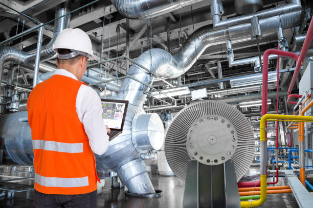 istock Engineer using laptop computer for maintenance in thermal power plant factory 808597346