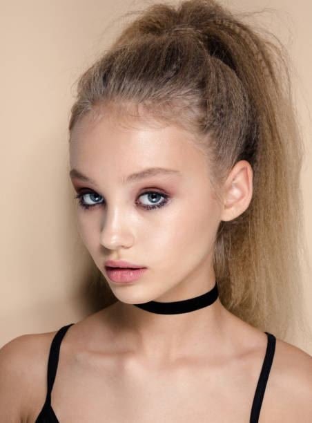 istock Young beautiful model with curly hair and fresh make-up 808625438