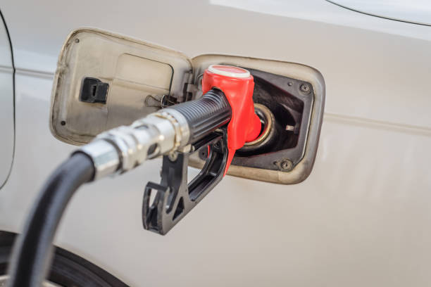 istock red refueling nozzle is inserted in the tank car at a gas station 808625932