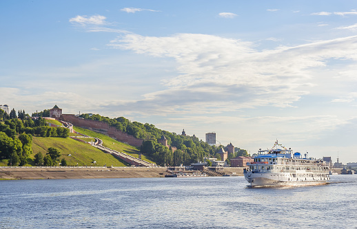 Passenger river boat on the background of the city of Nizhny Novgorod