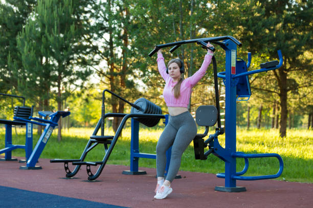 istock Young woman training on exercise equipmen 808645358