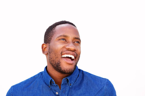istock Smiling young african guy looking away 808669398