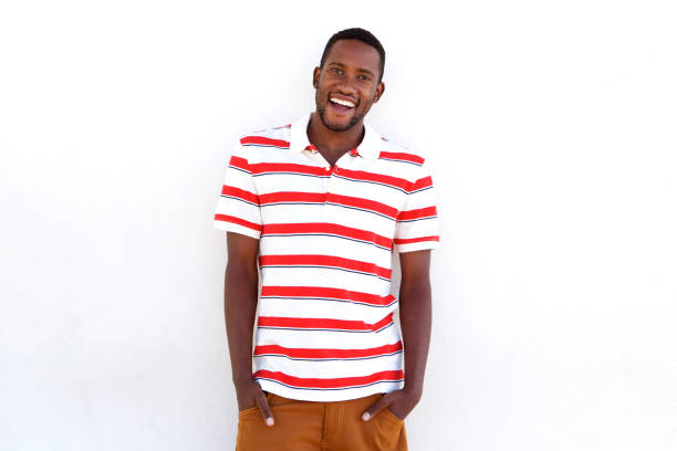 istock Confident young african man laughing with hands in pocket 808669428