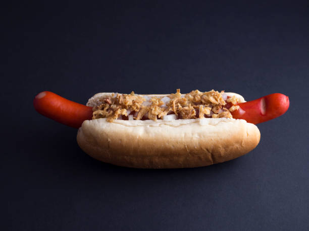 istock Danish hot dog isolated on black background 808692536