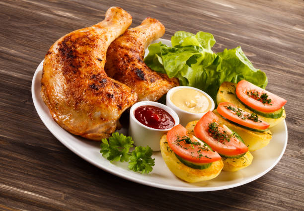 istock Roast chicken leg and vegetables 808692698