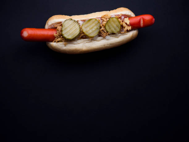 istock Danish hot dog isolated on black background 808693052