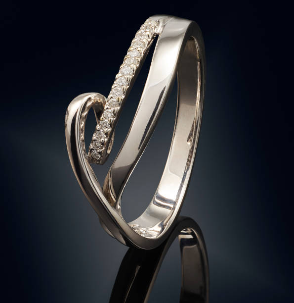 istock Golden ring with gemstone isolated on black background 808703530