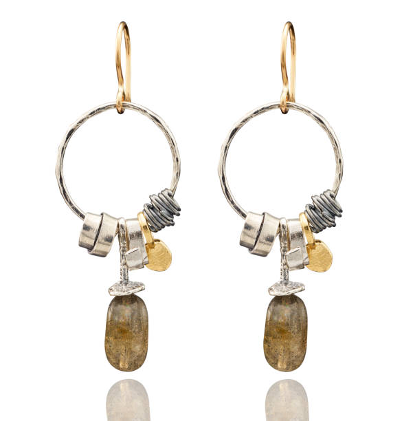 istock Golden earrings with gemstone isolated on white background 808703714