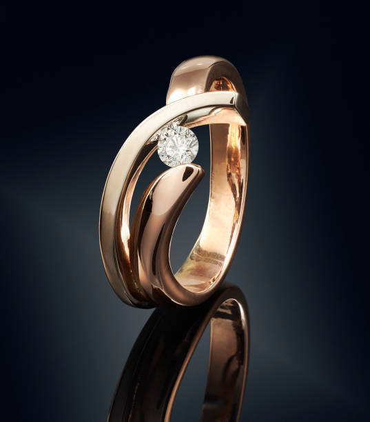 istock Golden ring with gemstone isolated on black background 808704048