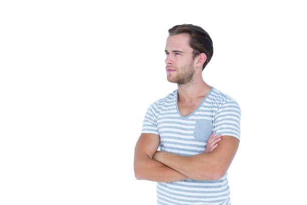 istock Handsome man looking away with arms crossed 808704536